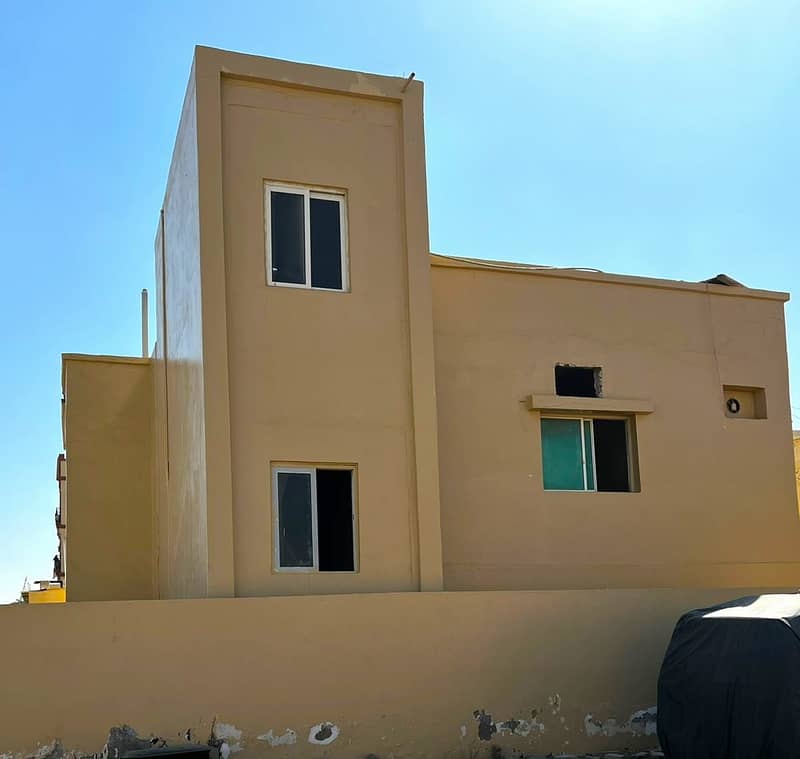 Two lands in Ajman ready house with shops