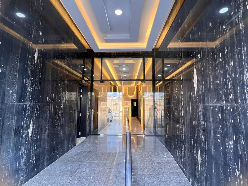 For rent in Ajman, a new building, the first inhabitant, a room, a hall, two rooms, and a hall in Karama, close to the Corniche