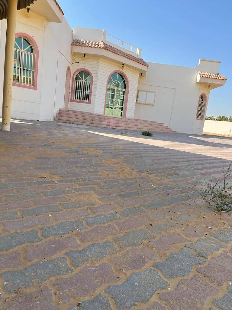 Villa for rent in Sharjah, Al Qarayen, a large area. The villa has 3 rooms, a hall, and a hall