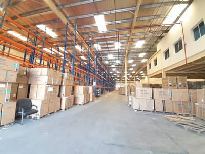 Warehouse for Rent in Dubai Investment Park (DIP), Dubai - Giant 25860 Sqft Warehouse | Racking Installed