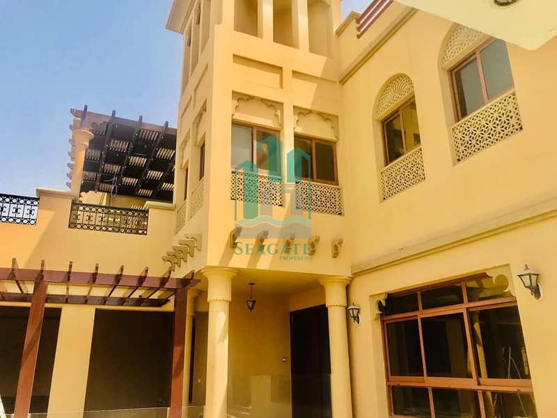 Spacious and bright 5 br plus maid villa with private pool and garden in jumeirah 2