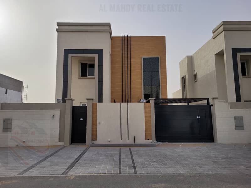 Super Dulux exterior design villa with excellent interior finishes for sale in the best areas of Ajman near the mosque and Sheikh Mohammed bin Zayed S