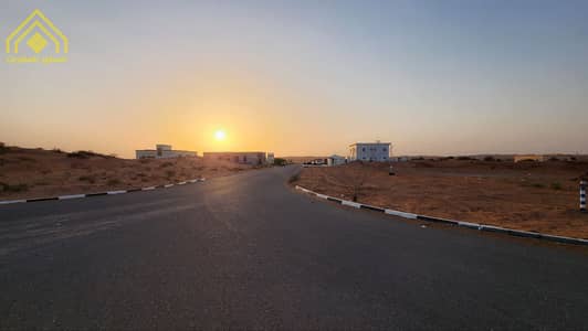 Plot for Sale in Falaj Al Mualla, Umm Al Quwain - For sale, residential land, corner of two streets, with permission to build on ground and first, with an area of ​​8400 feet