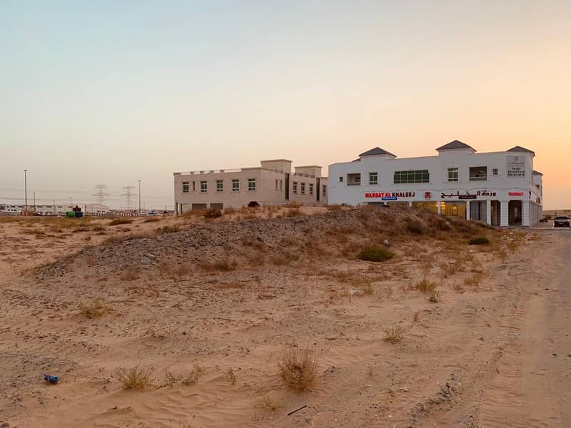 A piece of land in Sharjah, Al-Houshy area, commercial residential