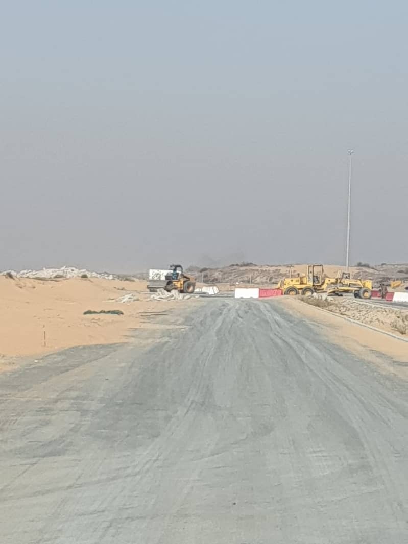 Land for sale in the best location in Hoshi Sharjah  excellent location price asphalt road