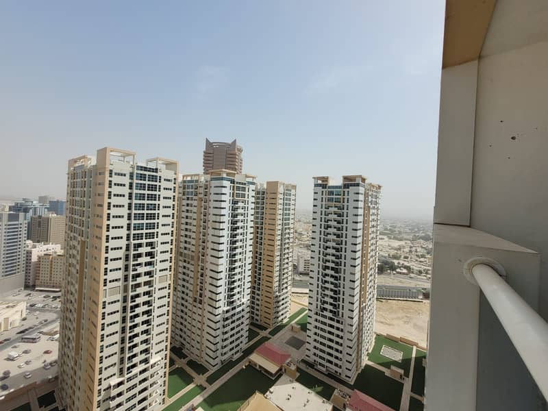 2 BEDROOM CLOSE KITCHEN GARDEN VIEW AVAILABLE FOR SALE IN AJMAN ONE TOWERS WITH PARKING LOW PRICE.