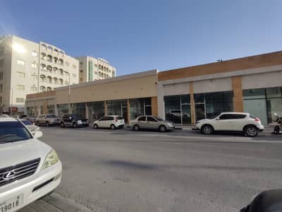 محل تجاري  للايجار في بوطينة، الشارقة - محلات ومعارض للايجار في منطقة البطينة على الشارع الرئيسي العروبة ( الشارق )