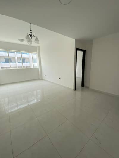 1 Bedroom Apartment for Rent in Al Karama Area, Ajman - The first inhabitant of the apartment, a room and a hall, with a balcony, 2 bathrooms, central air conditioning, large areas