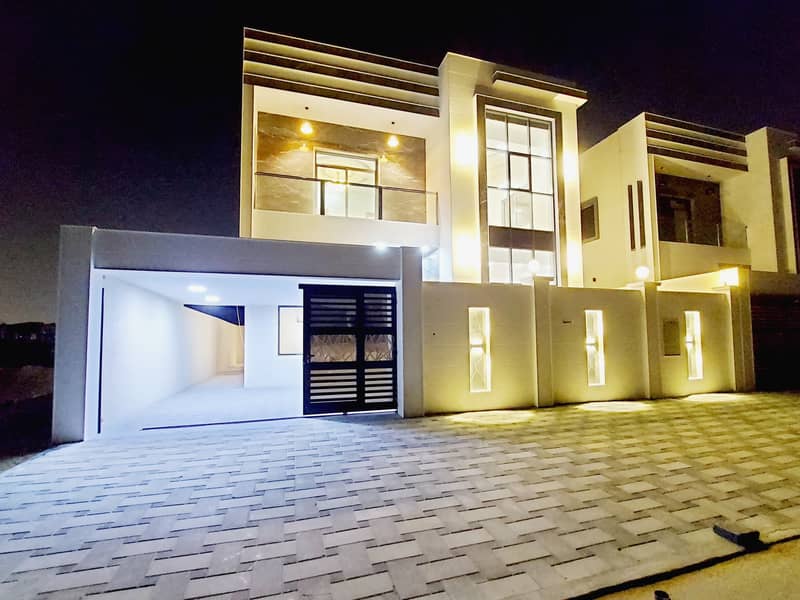 Villa super deluxe finishing, stone facade, large building area, in the finest residential places in Ajman