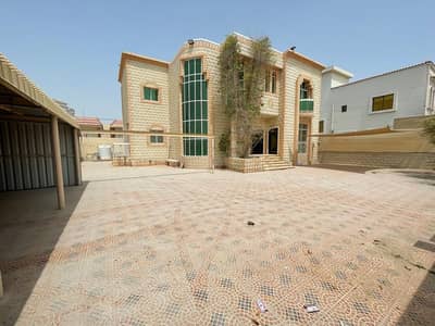 Villa for rent in Al Rawda, Ajman, close to services, a large area of ​​rooms, in addition to a garden