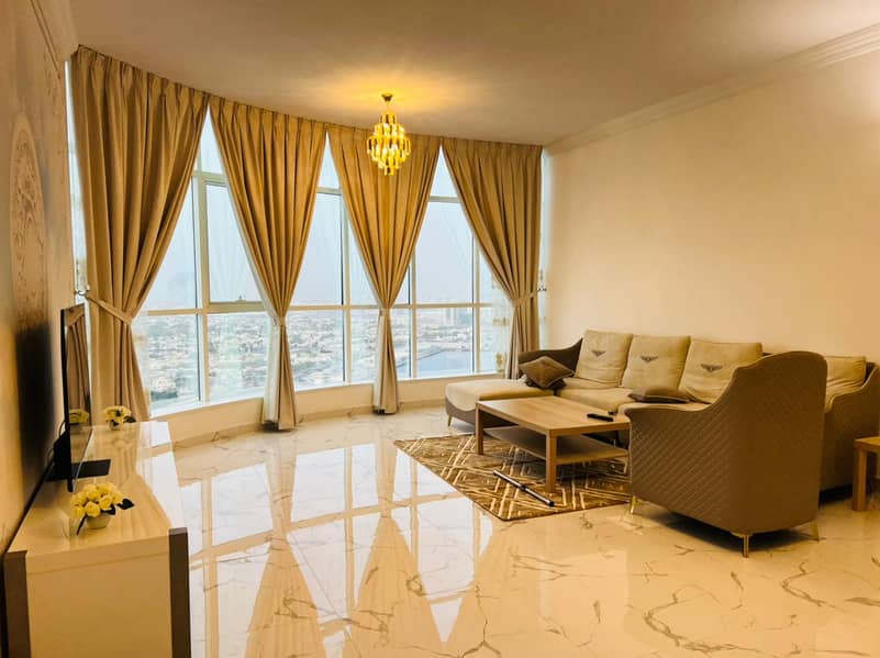 For rent in Ajman two-bedroom apartment and a hall furnished directly on the sea furnished new furniture