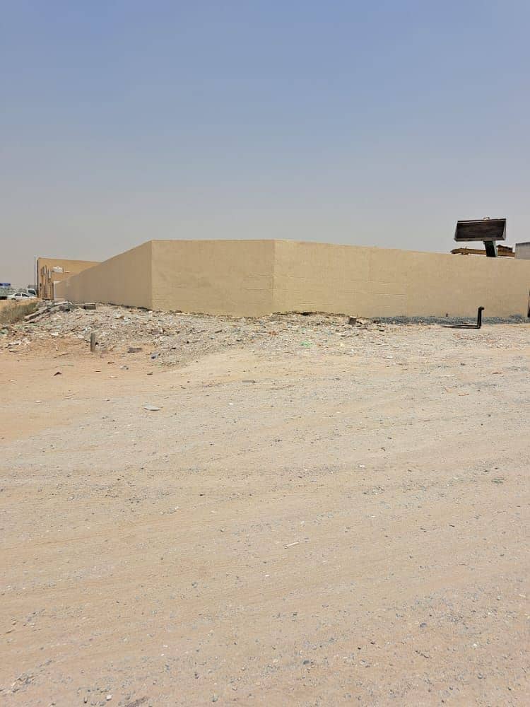 For rent in Sharjah / Al Sajaa Industrial Area Walled land  The second piece of the main street.