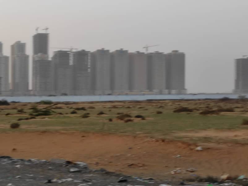For sale in Ajman, land in Al-Amrah, residential and investment