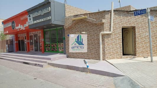 Shop for Sale in Al Rawda, Ajman - For sale a property consisting of 3 shop and 1 house in Ajman Al Rawda