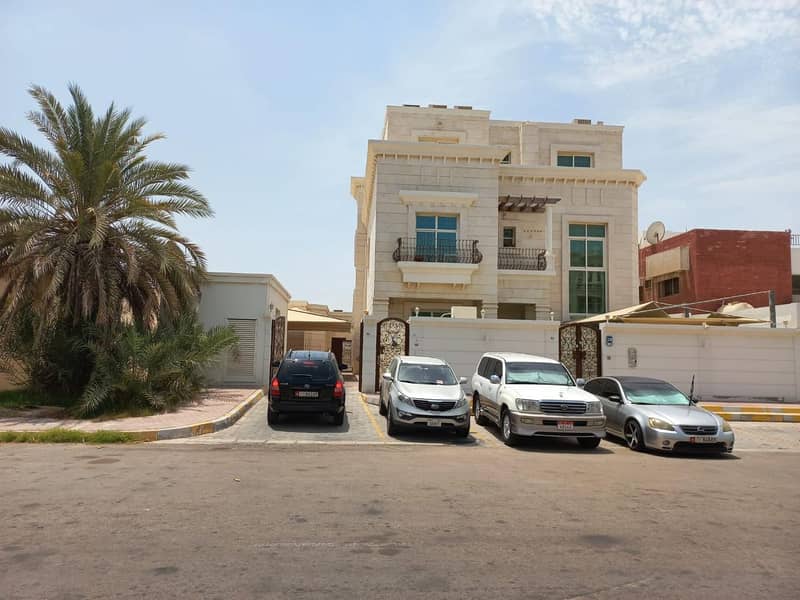 For sale a residential villa inside Abu Dhabi Island, Al Zaab, two floors, a roof, external services, monsters