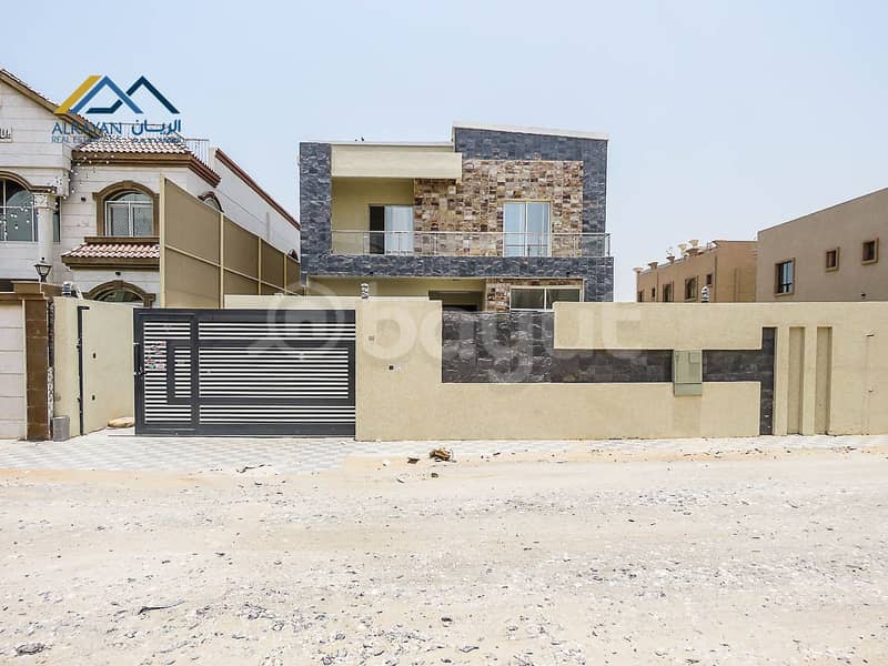 Corner villa, European design for sale in Al Rawda, 100% freehold, with the possibility of easy bank financing