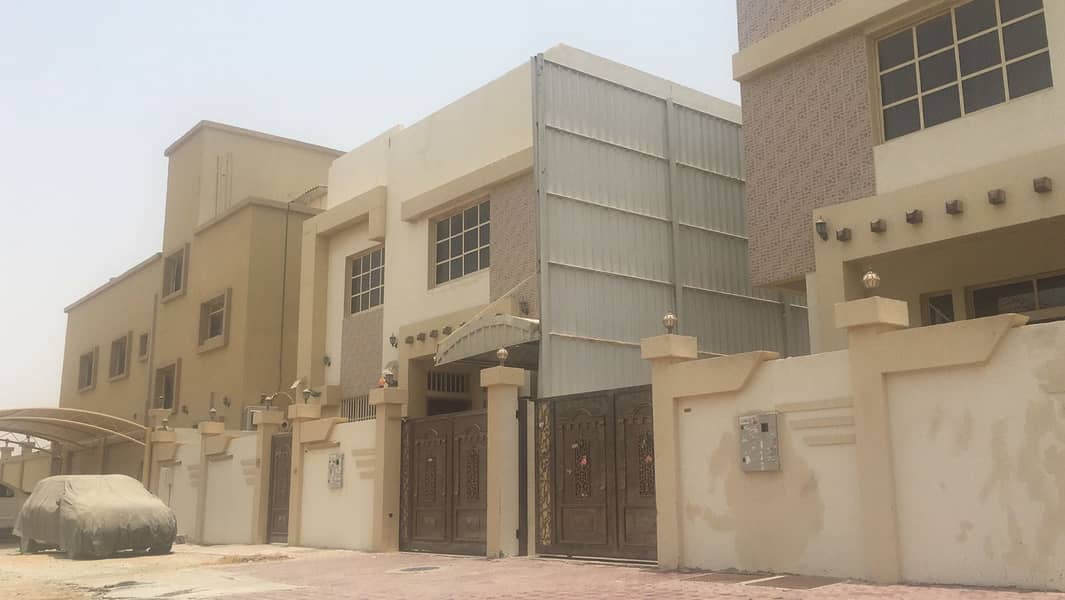 Villa for sale in Ajman, Al Rawda area, with electricity and water, personal finishing, an area