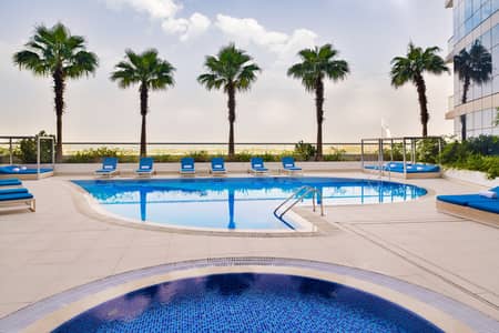 شقة فندقية 4 غرف نوم للايجار في البرشاء، دبي - Swimming Pool