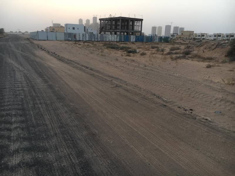 Lands for sale in Al Helio 2 on Sheikh Zayed Road, the price includes registration fees