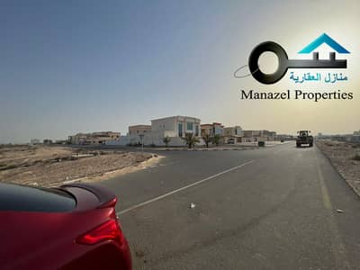 Plot for Sale in Al Salamah, Umm Al Quwain - For sale residential and commercial lands opposite the villas, a minute from the main Al Ittihad Street and 3 minutes from the main Sheikh Mohammed bi