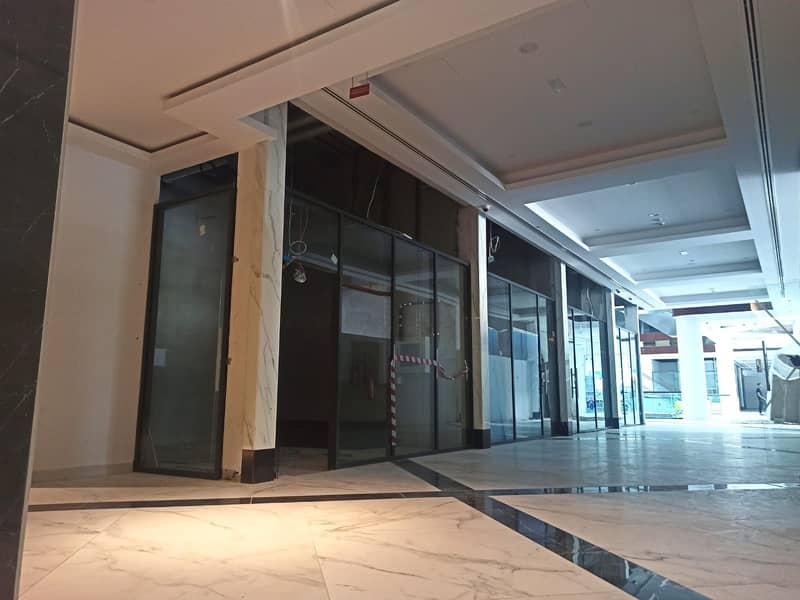 SHOP FOR RENT (330 sqft) @ Al Hudaiba Mall in Mina Road // Chiller air conditioning system + Basement Parking.