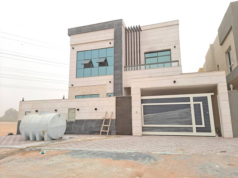 At the price of a modern villa, close to all services, central air conditioning, one of the most luxurious villas in Ajman, with personal construction