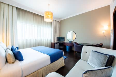 شقة فندقية  للايجار في برشا هايتس (تيكوم)، دبي - شقة فندقية في فيرست سنترال للشقق الفندقية برشا هايتس (تيكوم) 66000 درهم - 4369516