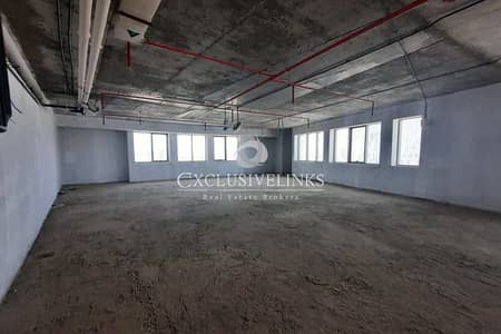 Office for Rent in Motor City, Dubai - Large Shell & Core Office | 4 Parking Space