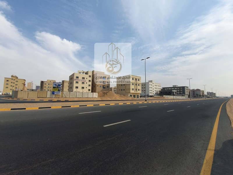 Two plots of residential and commercial land adjacent to each other for sale, Al Aliyah, Ajman, UAE.