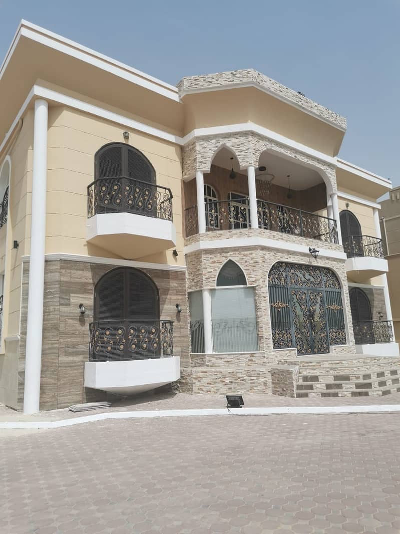 Villa for rent in Ajman, Al Raqaib area, two floors, fully faced with stone