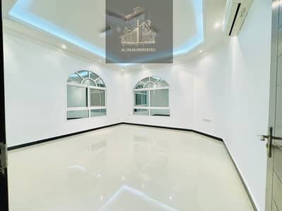 4 Bedroom Flat for Rent in Khalifa City A, Abu Dhabi - LUXURIOUS HUGE 4 BEDROOMS HALL WITH COVER PARKING IN A FAMILIES COMPOUND