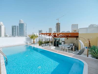 4 Bedroom Apartment for Sale in Jumeirah Village Circle (JVC), Dubai - One Of A Kind | Upgraded | 4 Bed | Pool and Bar