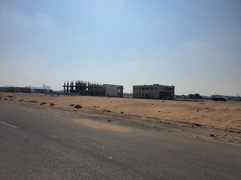 land for sale in the best location in Hoshi Sharjah  excellent location price asphalt road