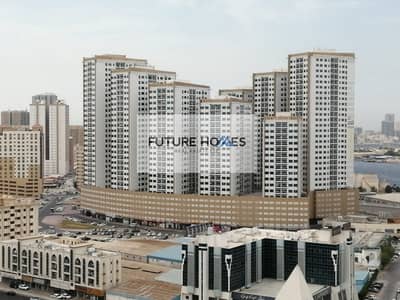 1 Bedroom Apartment for Sale in Ajman Downtown, Ajman - Affordable flat for sale in Ajman Pearl towers with Parking
