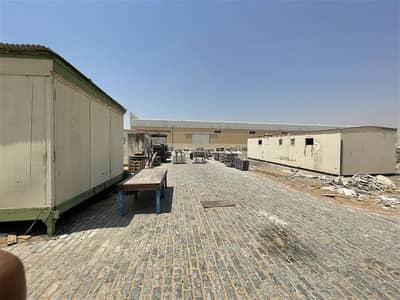 ارض صناعية  للبيع في الرملة، أم القيوين - Umm Al Quwain 100,000 Sq. Ft plot area with built-in open shed.