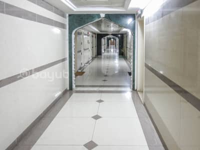 2 Bedroom Flat for Rent in Bu Daniq, Sharjah - 2 B/R HALL FLAT WITH SPLIT DUCTED A/C AVAILABLE IN BU DANIG AREA NEAR AL RAYAN HOTEL