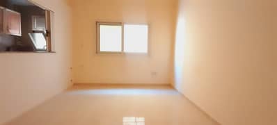 Spacious studio flat ready  to move  seprate kitchen family building  in al qulayaa sharjah .
