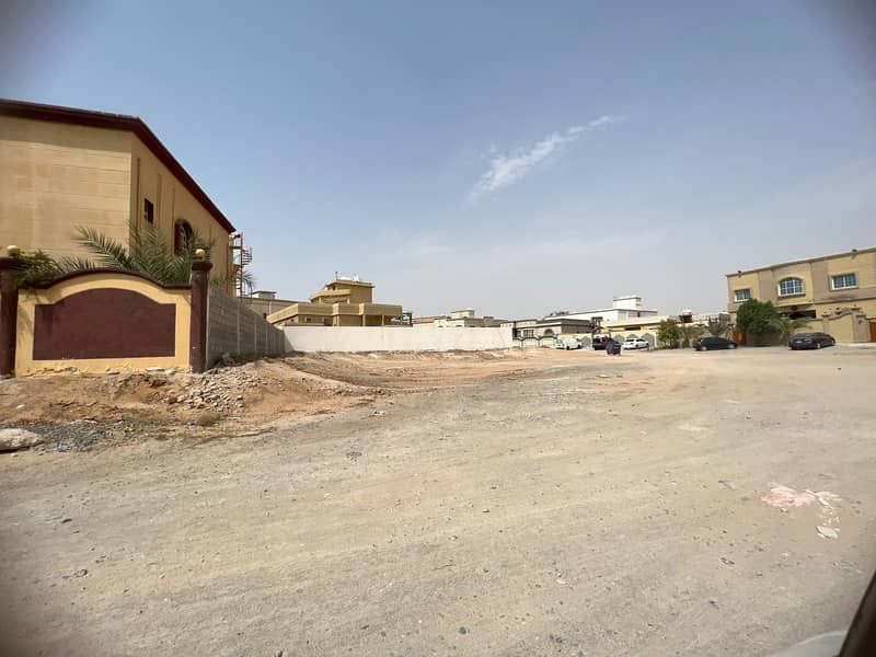 A piece of residential investment land on the corner of two streets near Ajman Academy, an area of ​​7250 feet, one million and 250 thousand required,