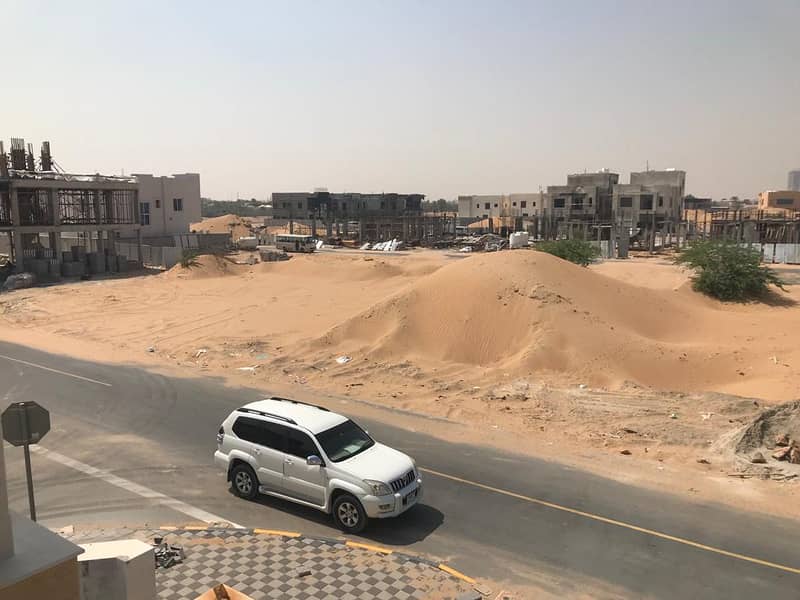 Plot of land for sale in Ajman Al Zahia, Ajman corner of two straight streets