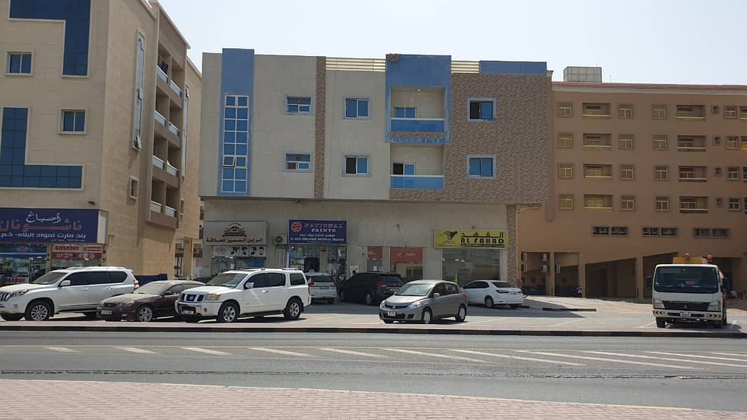 a New building in Al Jurf - Ajman - Income 498k - on Main Street - Freehold