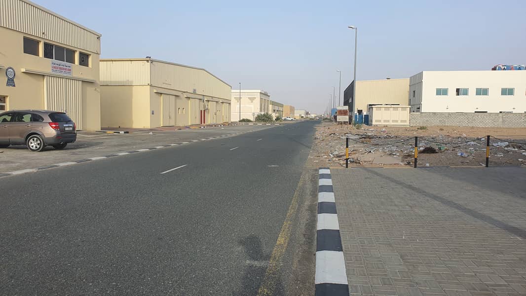 UNBELIVEABLE OFFER NEW NEAT AND CLEAN WAREHOUSE ONLY 45K WITH MEZANIN 3000 SQFT MAIN ROAD AL SAJAA 1