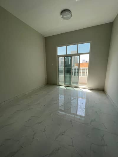 1 Bedroom Apartment for Rent in Corniche Ajman, Ajman - Room and lounge for the first inhabitant of a large area at a reasonable price