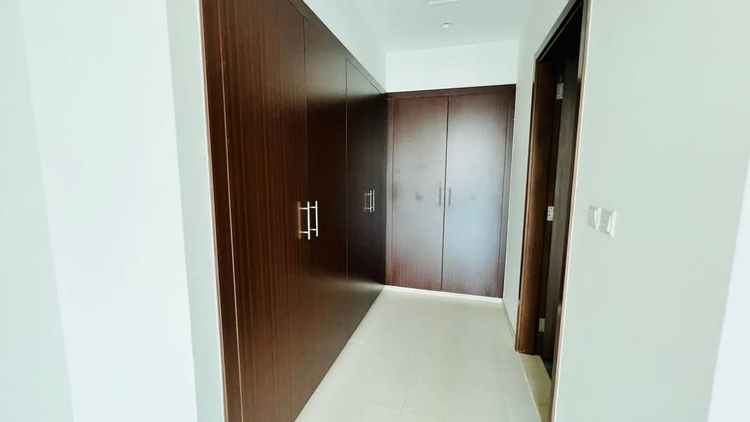 Spacious 2bhk With Balcony Wardrobes Close Kitchen pool gym parking Free only 61k Brand New Community