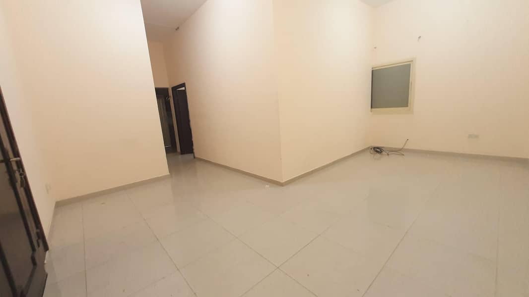 Apartment with a very large room and hall in Shakhbout city, ground floor, private entrance, near ADNOC station, monthly