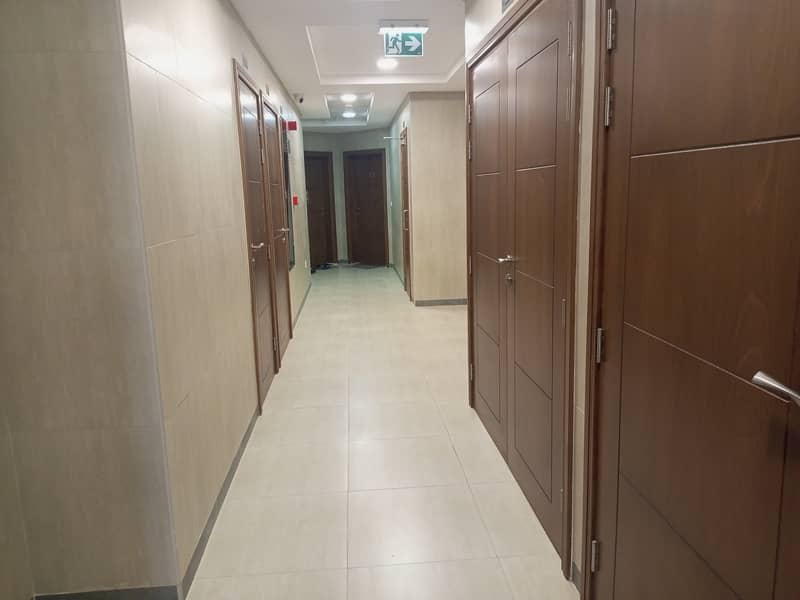 BRAND NEW  1BHK with balcony just 25k in Tilal city Sharjah