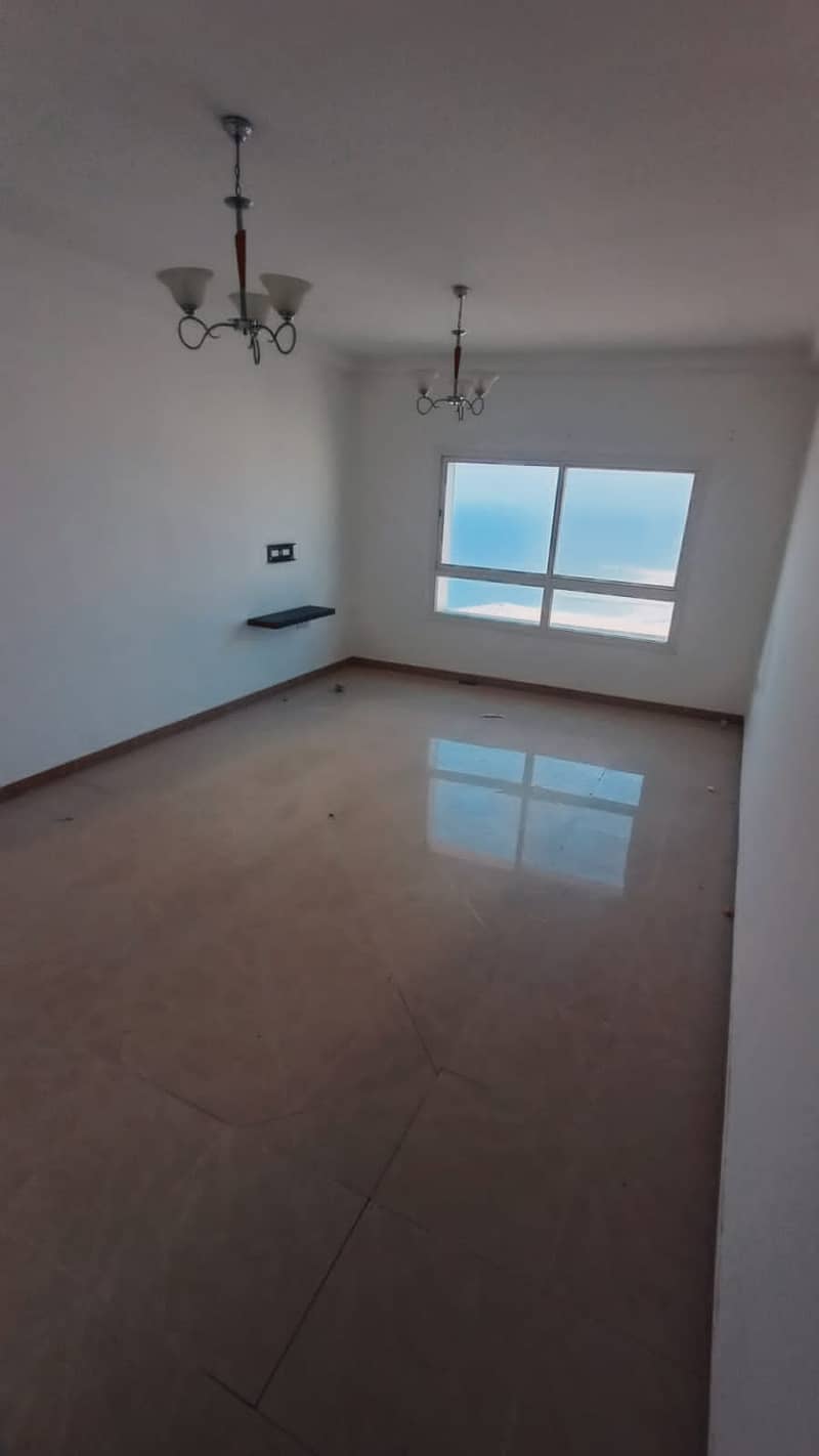 For rent in Ajman a room, a hall, studios, two rooms and a hall in the Corniche area, Ajman, direct, open view, excellent