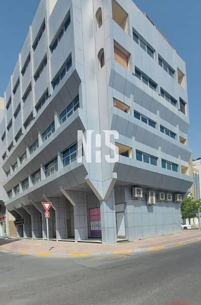 مبنى سكني  للبيع في آل نهيان، أبوظبي - بناية زاوية على 3 شوارع مكونة من 5 طوابق