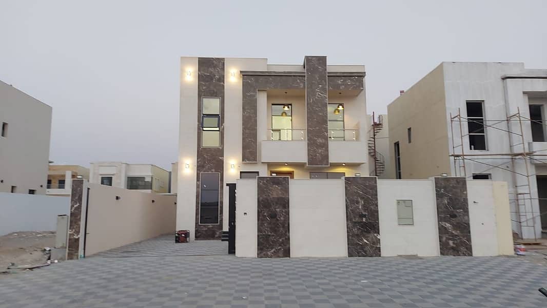Opposite the mosque, a modern villa, one of the most luxurious villas in Ajman, with a hotel design, building and personal finishing, super deluxe, bu