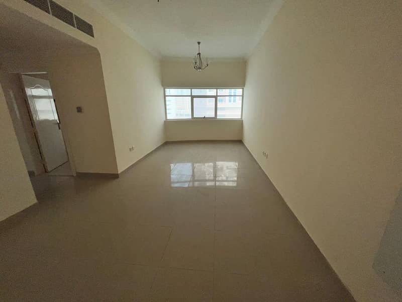 Apartment two rooms and a hall, 2 bathrooms, with a balcony, in Al Nuaimiya 1, second row from Sheikh Khalifa Street, close to Al-Hikma School