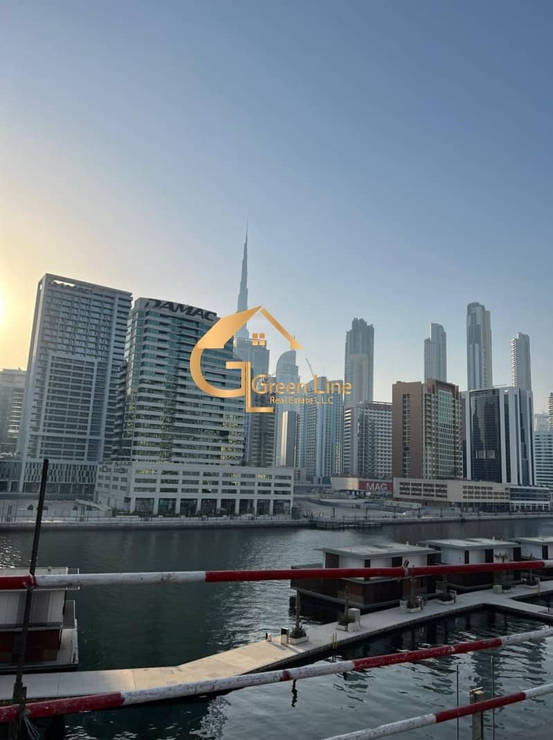 Unequivocally Great Investment Deal | Shell-and-Core Shop in Business Bay | Full Canal and Burj View